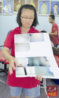 陈金梅展示19楼面对的10年漏水问题。