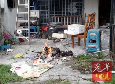 男子周三中午以家庭园烧杂物。