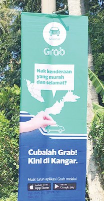GrabCar在玻璃市加央提供召车应用程序(App)服务。