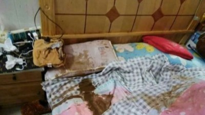 暖水袋爆裂喷出大量褐色液体。