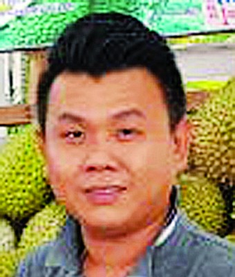 榴梿之家老板谢伟成。