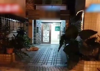 梁男将母亲的头颅掉丢到楼下。