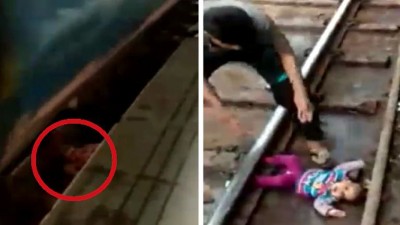 列车在女婴身上驶过。