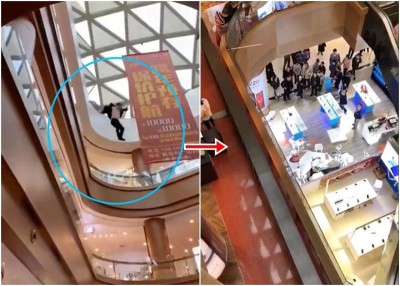 一名男子（左）于商场高处跳下受伤，压中一个商户专柜。
