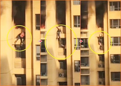 男子先把女子放下楼下单位的窗台上，然后再扶着墙壁慢慢爬下。