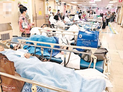 流感高峰期爆发令香港各公院急症室及内科病房超负荷。