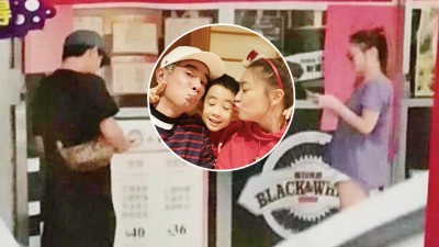 陈小春往离老婆应采儿有些距离了才抽烟。