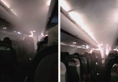 机舱内白烟环绕。（网络视频截图）